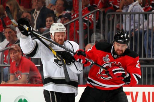 Los Angeles Kings' Colin Fraser (L) and New Jersey Devils' Marek Zidlicky fight for position during game one of their NHL Stanley Cup Final on May 30. Fraser gave the Kings the lead in the first period