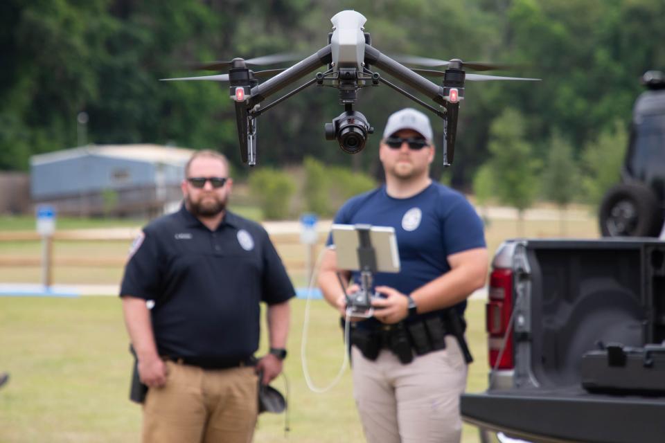 Hallandale Police Department Sgt. Andrew McClelland, right, and Officer Galen Wilson fly their department's drone during a hurricane preparedness training facilitated by Florida State University at Apalachee Regional Park Thursday, June 3, 2021.