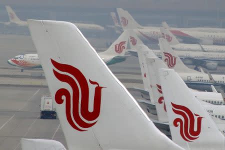 Flights of Air China are parked on the tarmac of Beijing Capital International Airport in Beijing, China, March 28, 2016. REUTERS/Kim Kyung-Hoon/File Photo