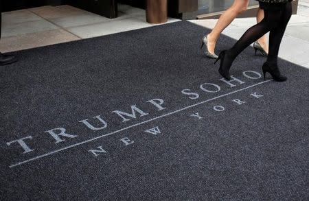 FILE PHOTO: Women walk across a carpet outside of the Trump Soho Hotel in New York, U.S. on April 9, 2010. REUTERS/Jessica Rinaldi/File Photo