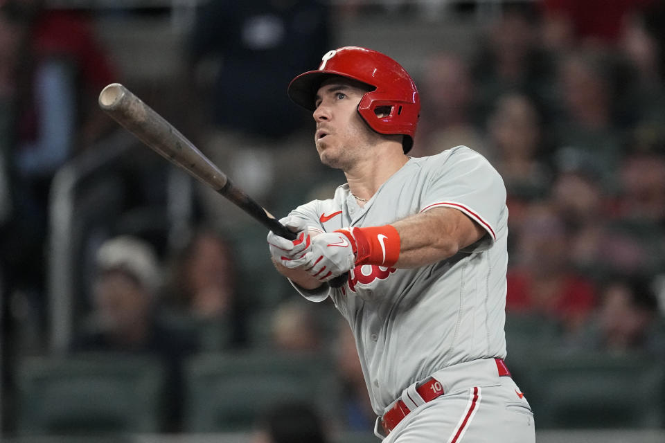 Philadelphia Phillies' J.T. Realmuto watches his solo home run in the fourth inning of a baseball game against the Atlanta Braves Monday, Sept. 18, 2023. (AP Photo/John Bazemore)