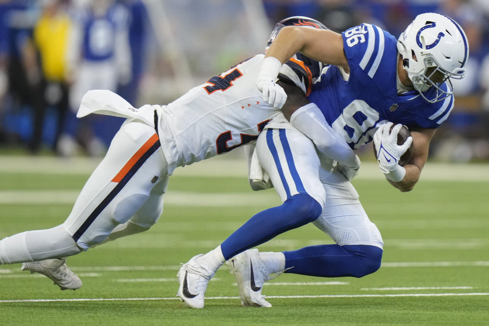 Denver Broncos safety Keidron Smith (43) tackles Indianapolis Colts tight end Will Mallory (86) during the second quarter of a preseason NFL football game, Sunday, Aug. 11, 2024, in Westfield, Ind. (AP Photo/AJ Mast)