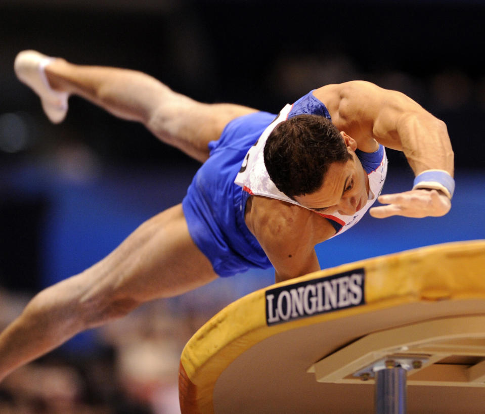 Thomas Bouhail of France performs on the vault during men's vault final of the World Gymnastics Championships in Tokyo on October 16, 2011.   AFP PHOTO / KAZUHIRO NOGI (Photo credit should read KAZUHIRO NOGI/AFP/Getty Images)