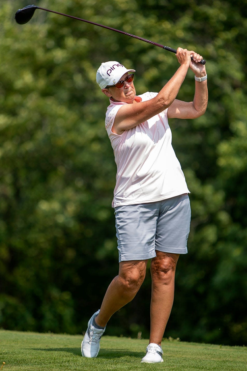 Gail Hannam watches her drive from the 13th tee at Lake Bracken during the final round of the Galesburg Women's All-City Golf Tournament on Friday, July 23, 2021.