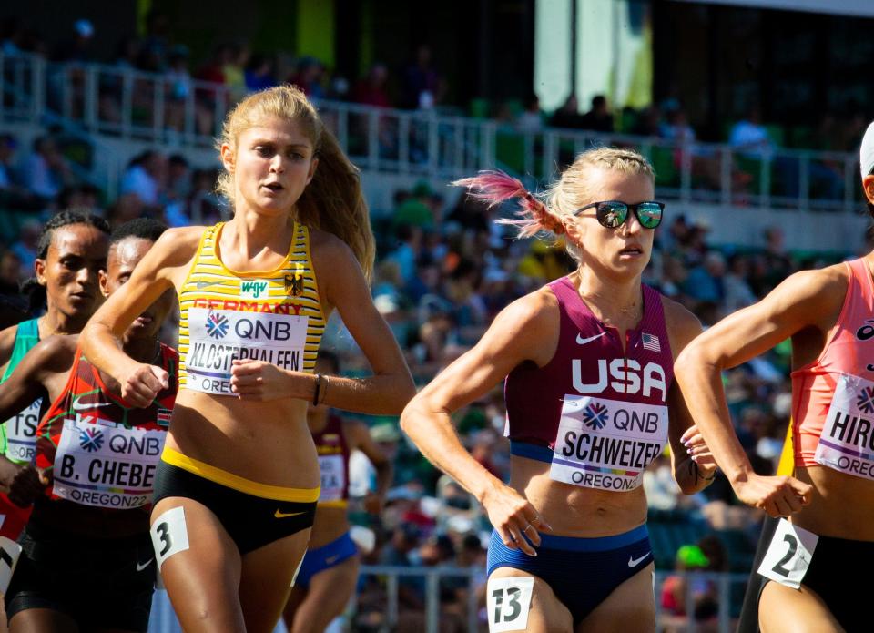 Germany's Konstanze Klosterhalfen, left, and Karissa Schweizer compete in the women's 5,000 meters World Athletics Championships Wednesday, July 20, 2022, at Hayward Field in Eugene, Ore.