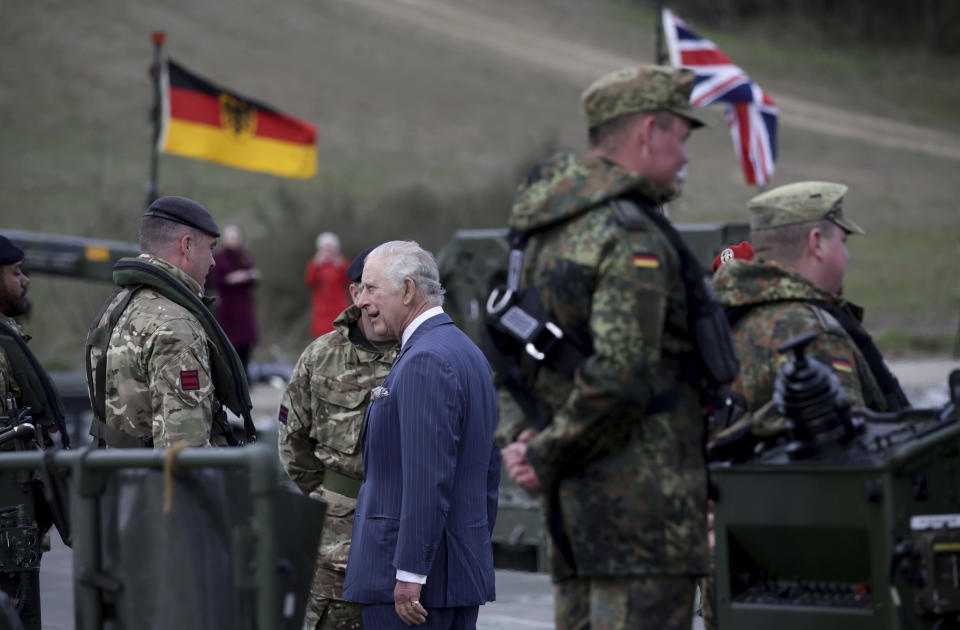 Britain's King Charles III talks with soldiers during his visit at the 130th German-British Pioneer Bridge Battalion military unit in Finowfurt, eastern Germany, on Thursday, March 30, 2023.(Jens Schlueter /Pool Photo via AP)