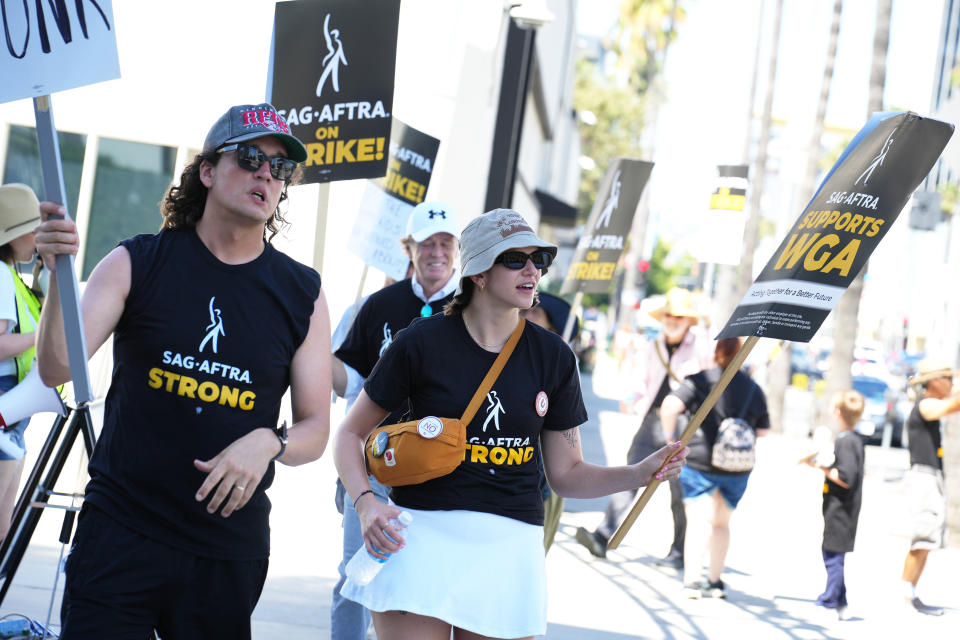 LOS ANGELES, CALIFORNIA - JULY 20: Members and supporters of SAG-AFTRA and WGA walk the picket line at Sunset Gower Studios on July 20, 2023 in Los Angeles, California. Members of SAG-AFTRA, Hollywood's largest union which represents actors and other media professionals, have joined striking WGA (Writers Guild of America) workers in the first joint walkout against the studios since 1960. The strike could shut down Hollywood productions completely with writers in the third month of their strike against the Hollywood studios. (Photo by JC Olivera/Getty Images)