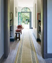 <p> A great option for hallway carpet, hallway carpet runners can create a zone of comforting texture, and establish a beautiful union of contrasting materials on the floor. </p> <p> In this hallway, the Kersaint Cobb Morocco Runner in the Tetouan finish adds a subtle feature of color, texture and striped pattern. The design is also crafted from sisal, which is perfect for hardwearing, heavy traffic areas such as hallways, entryways and stairs.&#xA0; </p> <p> Creating an inviting entrance into the home, this long runner works wonderfully with the light wood flooring to help you move through the entrance in comfort and style. </p>