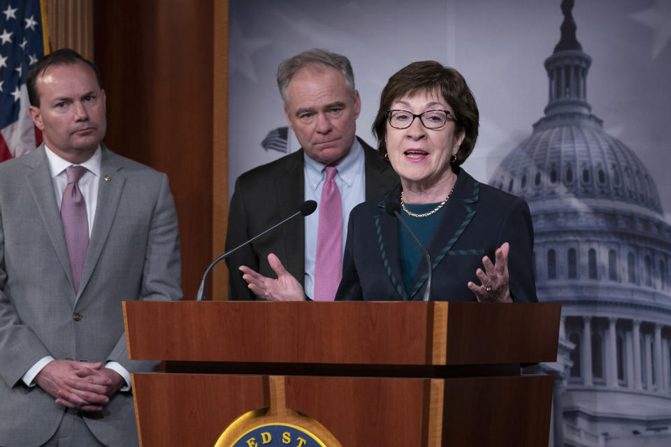 From left, Sen. Mike Lee, R-Utah, Sen. Tim Kaine, D-Va., and Sen. Susan Collins, R-Maine, speak to reporters just after the Senate advanced a bipartisan resolution asserting that President Donald Trump must seek approval from Congress before engaging in further military action against Iran, at the Capitol in Washington, Wednesday, Feb. 12, 2020. (AP Photo/J. Scott Applewhite)