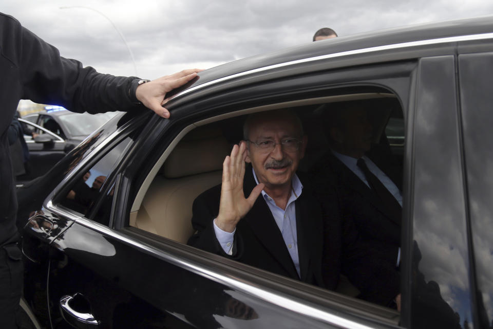 Kemal Kilicdaroglu, the leader of Turkey's main opposition Republican People's Party, leaves after being attacked by protesters during the funeral of a soldier who was slain during clashes with Kurdish rebels at Iraq border, outside Ankara, Turkey, Sunday, April 21, 2019. The politician was not hurt, party officials said. Protestors at a village outside of Ankara threw punches at Kemal Kilicdaroglu as security officials tried to escort him away from the crowd, television footage showed. (AP Photo)