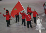 <p>Samir Azzimani carries the flag of Morocco during the opening ceremony of the 2018 Winter Olympics in Pyeongchang, South Korea, Friday, Feb. 9, 2018. (AP Photo/Michael Sohn) </p>