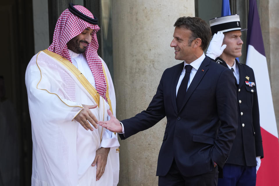 Saudi Crown Prince Mohammed bin Salman is to shake hands with French President Emmanuel Macron, Friday, June 16, 2023 at the Elysee Palace in Paris. Saudi Crown Prince Mohammed bin Salman meets Emmanuel Macron as part of an official visit, during which he will also participate in a global financing summit aimed at fighting poverty and climate change. (AP Photo/Michel Euler)