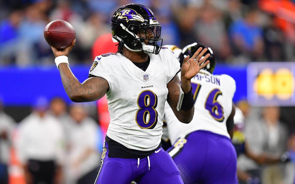 Nov 26, 2023; Inglewood, California, USA; Baltimore Ravens quarterback <a class="link " href="https://sports.yahoo.com/nfl/players/31002" data-i13n="sec:content-canvas;subsec:anchor_text;elm:context_link" data-ylk="slk:Lamar Jackson;sec:content-canvas;subsec:anchor_text;elm:context_link;itc:0">Lamar Jackson</a> (8) throws against the Los Angeles Chargers during the first half at SoFi Stadium. Mandatory Credit: Gary A. Vasquez-USA TODAY Sports