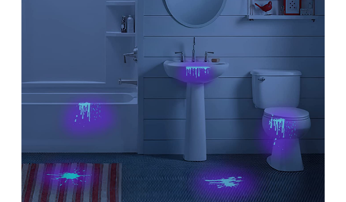 mess in bathroom aglow from black light