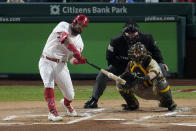 Philadelphia Phillies' Kyle Schwarber hits home run during the first inning in Game 3 of the baseball NL Championship Series between the San Diego Padres and the Philadelphia Phillies on Friday, Oct. 21, 2022, in Philadelphia. (AP Photo/Matt Rourke)