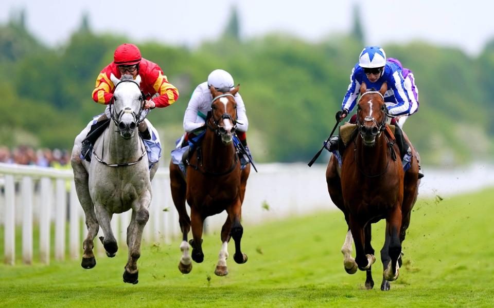 The Foxes ridden by jockey Oisin Murphy (right, blue and white silks) on their way to winning the Al Basti Equiworld Dubai Dante Stakes - PA Wire/Mike Egerton