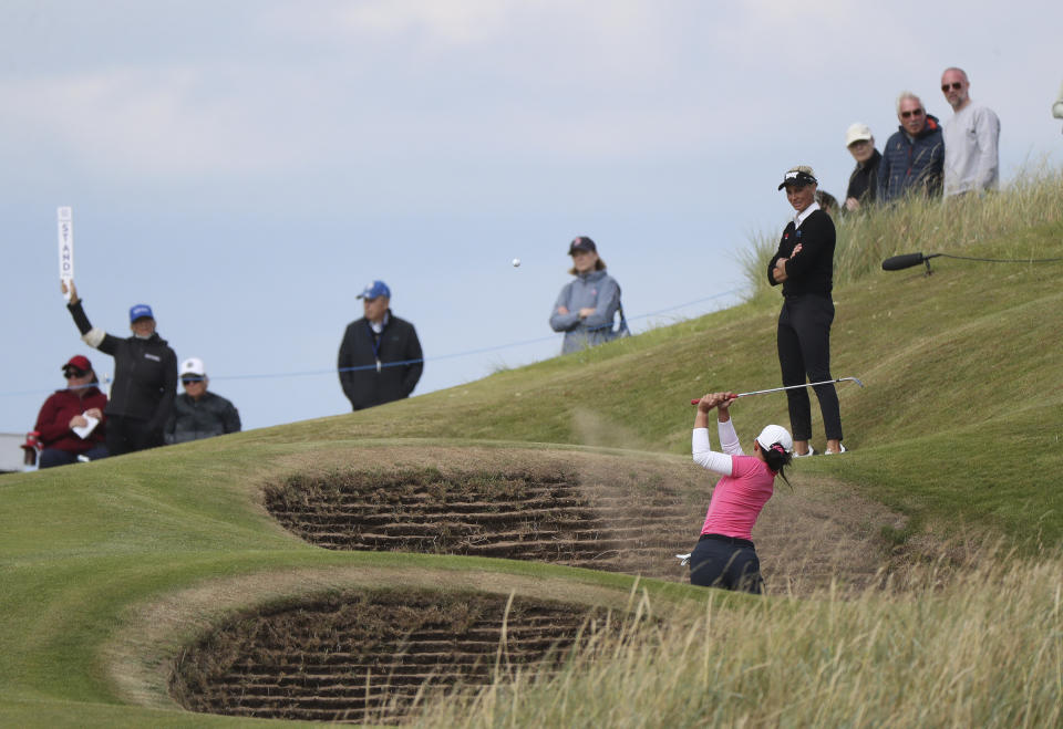 Thailand's Pajaree Anannarukarn plays her shot from the 13th green bunker during the second round of the Women's British Open golf championship, in Muirfield, Scotland Friday, Aug. 5, 2022. (AP Photo/Scott Heppell)