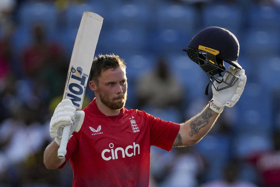 England's Phil Salt celebrates after he scored a century against England during the third T20 cricket match at National Cricket Stadium in Saint George's, Grenada, Saturday, Dec. 16, 2023. (AP Photo/Ricardo Mazalan)