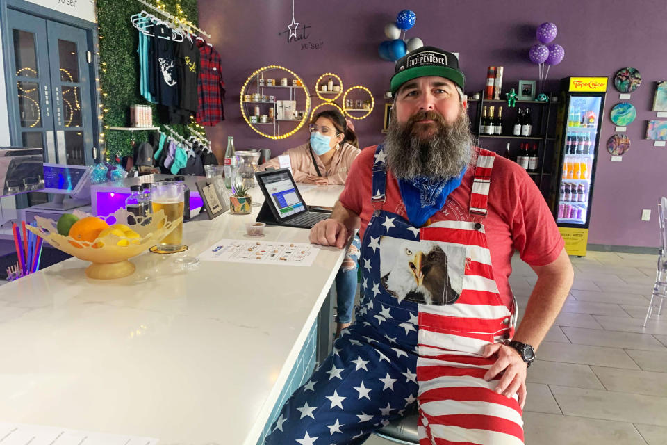 Steven Burts attends an inauguration watch party in Houston. Burts, a Republican who opposed Trump, hopes the Biden administration will bring healing to his relationships with Trump-supporting friends and family. (Mike Hixenbaugh / NBC News)