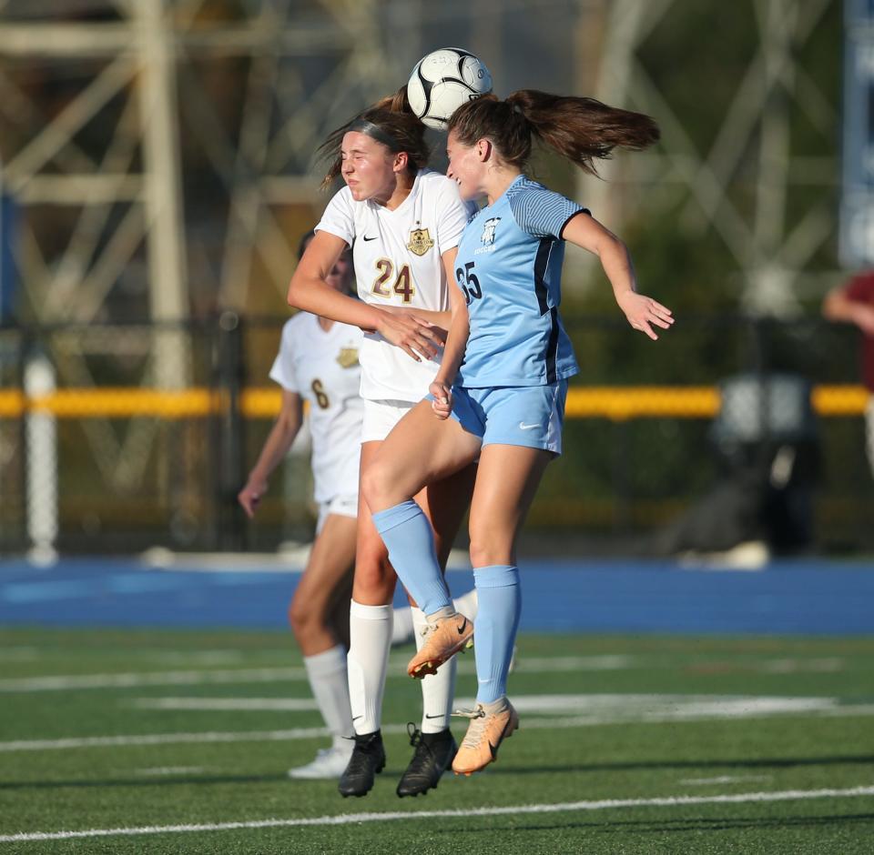 John Jay's Ava Jordan and Arlington's Grace McGann go up for a header during a girls soccer game on October 4, 2023.