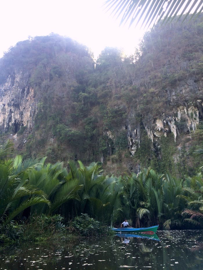 Boat ride: The river afforded a remarkable view of karsts with gaping caves, towering cliffs and local people riding by on boats going about their daily routines.