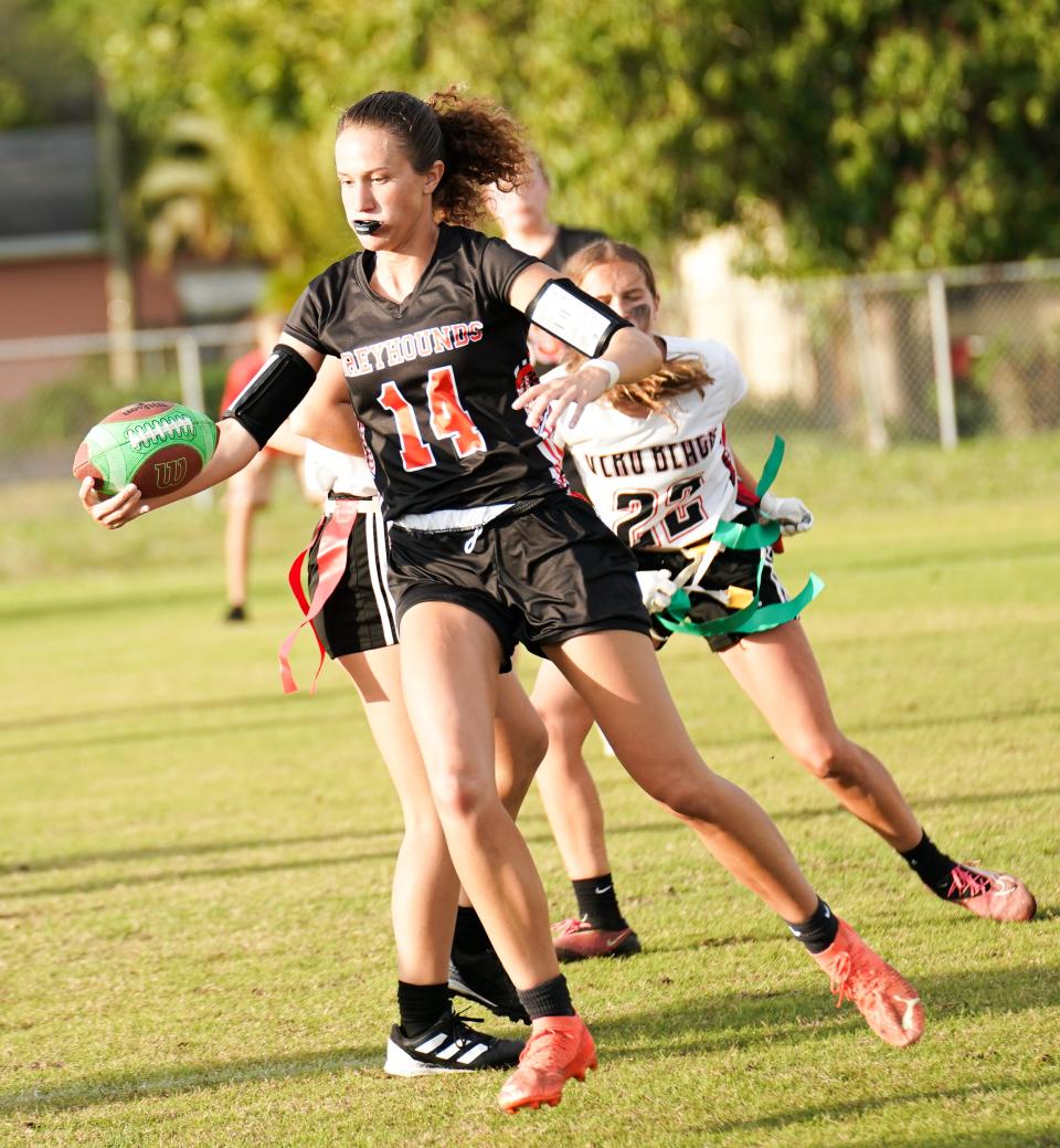 Lincoln Park Academy quarterback Leah Murphy gains yardage in a flag football game against Vero Beach on Thursday, March 7, 2024 in Fort Pierce. Lincoln Park Academy won 20-0.