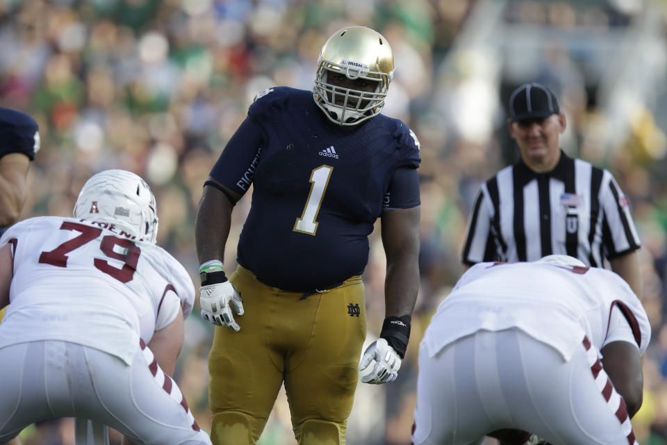 FILE - In this Saturday, Aug. 31, 2013, file photo, Notre Dame defensive lineman Louis Nix III (1) prepares to get into his defensive stance during the second half of an NCAA college football game against Temple in South Bend, Ind. Nix’s mother, Stephanie Wingfield, says authorities told her that her son had died but they were unable to give her more information about his death. The Jacksonville Sheriff’s Office said in a tweet Saturday, Feb. 27, 2021, that Nix was located, but didn’t give any other details. (AP Photo/Michael Conroy, File)