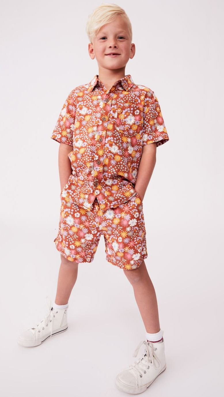 boy dressed in resort shirt and short set