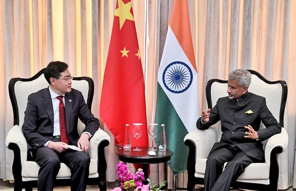 Indian foreign minister S Jaishankar talks with his Chinese counterpart Qin Gang on the sidelines of G20 foreign ministers meeting (AP)