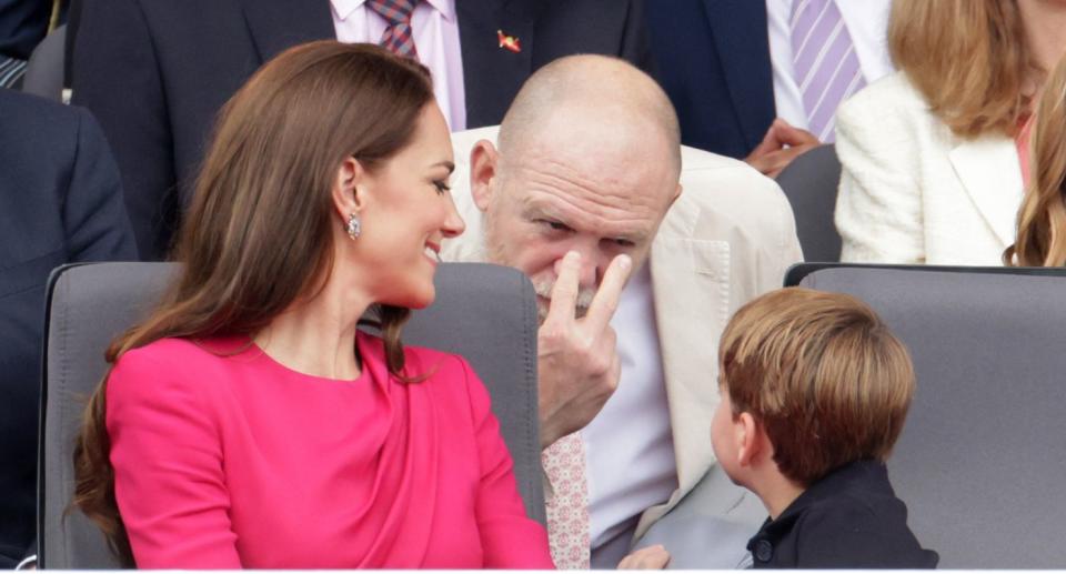 Mike Tindall gives an 'I'm watching you' gesture to Prince Louis at the Queen's Platinum Jubilee as Kate Middleton looks on with a smile. (Getty Images)