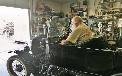  Dennis in Ron’s workshop in Culver  - Credit: Courtesy of Tim Moore