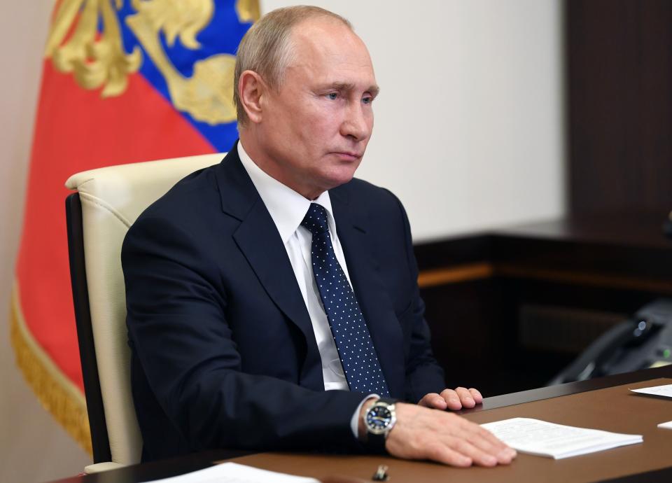 Russian President Vladimir Putin takes part in a videoconference with Cabinet officials at the Novo-Ogaryovo residence outside Moscow, Russia, Tuesday, May 19, 2020. Putin instructed the Cabinet to ensure payments of additional payments to medics that he has ordered. (Alexei Nikolsky, Sputnik, Kremlin Pool Photo via AP)