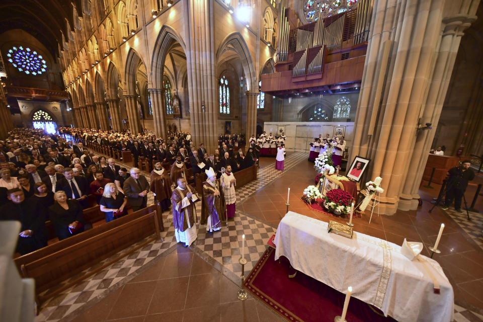 Archbishop Anthony Fisher, center, performs as principal celebrant of the requiem mass for Cardinal George Pell at St. Mary's Cathedral in Sydney, Thursday, Feb. 2, 2023. Pell, who died last month at age 81, spent more than a year in prison before his sex abuse convictions were overturned in 2020. (Giovanni Portelli/Pool Photo via AP)