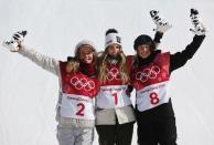 Snowboarding - Pyeongchang 2018 Winter Olympics - Women's Big Air Final Run 3 - Alpensia Ski Jumping Centre - Pyeongchang, South Korea - February 22, 2018 - Gold medallist Anna Gasser of Austria flanked by silver medallist Jamie Anderson of the U.S. and bronze medallist Zoi Sadowski-Synnott of New Zealand hold Soohorang Olympics plush mascots during the flower ceremony. REUTERS/Murad Sezer