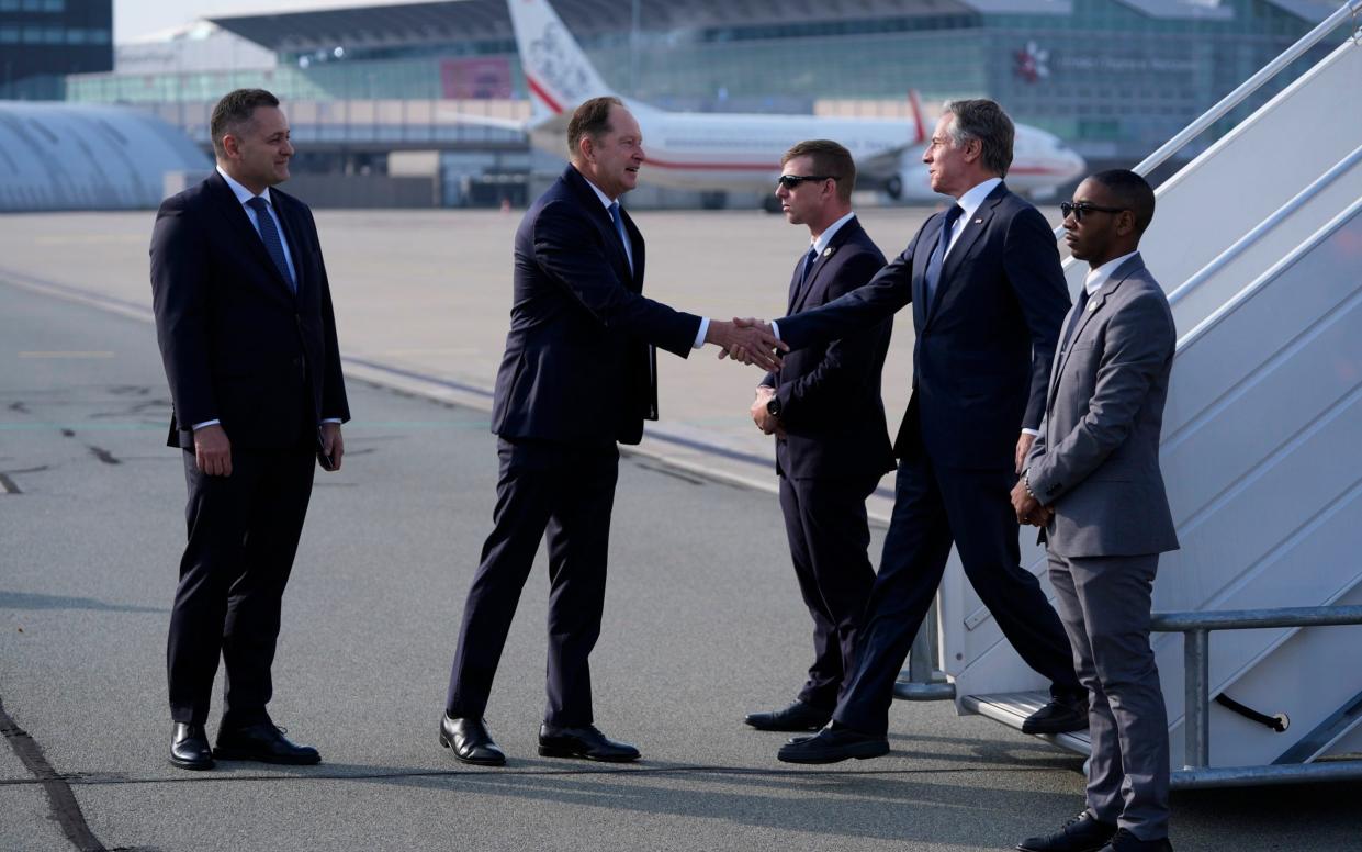 Antony Blinken is welcomed by the US ambassador to Poland Mark Brzezinski as he arrives at Chopin Airport in Warsaw