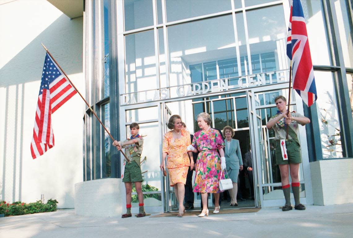 Queen Elizabeth and Dallas Mayor Annette Strauss walk out of the Dallas Garden Center. Kay Granger, newly elected mayor of Fort Worth, is behind them.