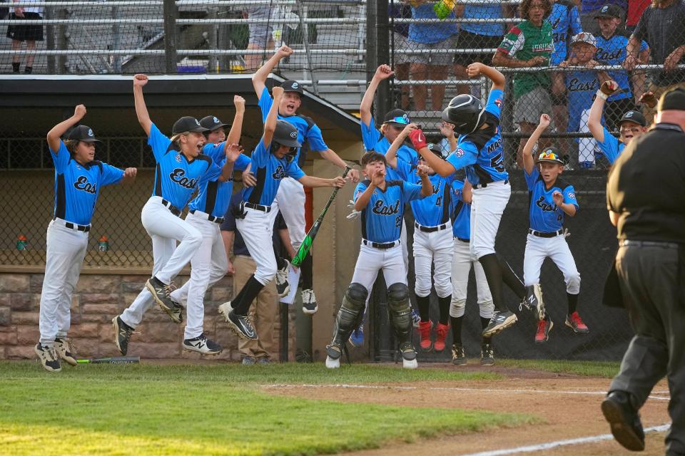 Aug 10, 2022; Bristol, CT, USA; Toms River East pitcher Logan Macchia (54) celebrates his two-run home run with his teammates during the first inning against Connecticut at Bartlett Giamatti Little League Leadership Training Center. Mandatory Credit: Gregory Fisher-USA TODAY Sports