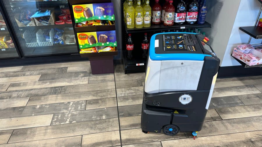 A robot cleans the floor at a J&H in Coopersville. (Feb. 12, 2024)