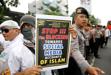 Muslim protesters rally outside the local Facebook office, angry over the social media giant's blocking of some sites, in Jakarta, Indonesia January 12, 2018. REUTERS/Darren Whiteside