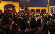 Soccer fans argue with security personnel as they attempt to enter a stadium before a scuffle broke out, on the outskirts of Cairo February 8, 2015. REUTERS/Stringer