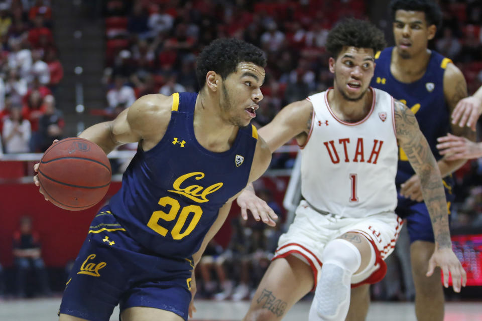 California guard Matt Bradley (20) drives around Utah forward Timmy Allen (1) during the first half of an NCAA college basketball game Saturday, Feb. 8, 2020, in Salt Lake City. (AP Photo/Rick Bowmer)