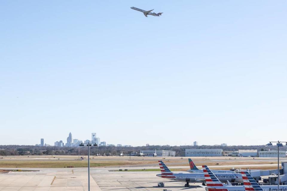 A plane takes off from Charlotte Douglas International Airport during one of the busiest days for holiday travel on Friday, December 23, 2022.