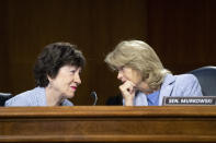 Sen. Susan Collins, R-Maine, left, and Sen. Lisa Murkowski, R-Alaska, talk during a Senate Appropriations Committee hearing to examine proposed budget estimates and justification for fiscal year 2022 for the Department of Defense in Washington on Thursday, June 17, 2021. (Caroline Brehman/Pool via AP)