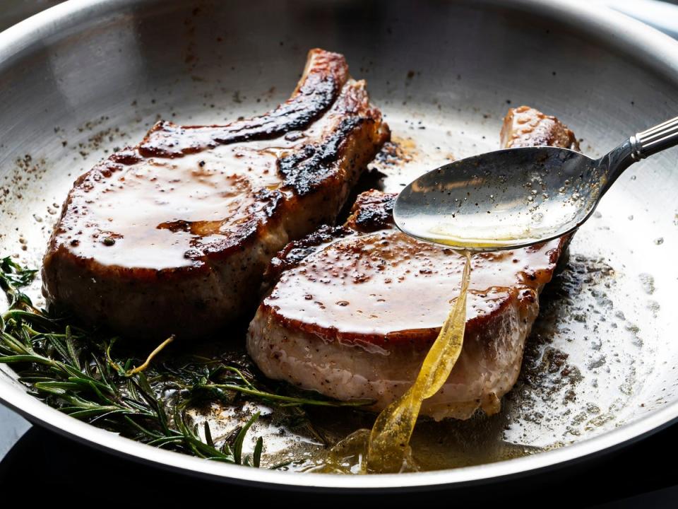 Use a large spoon to baste the chops with the butter, until the meat has an internal temperature of about 57C (Scott Suchman/The Washington Post)