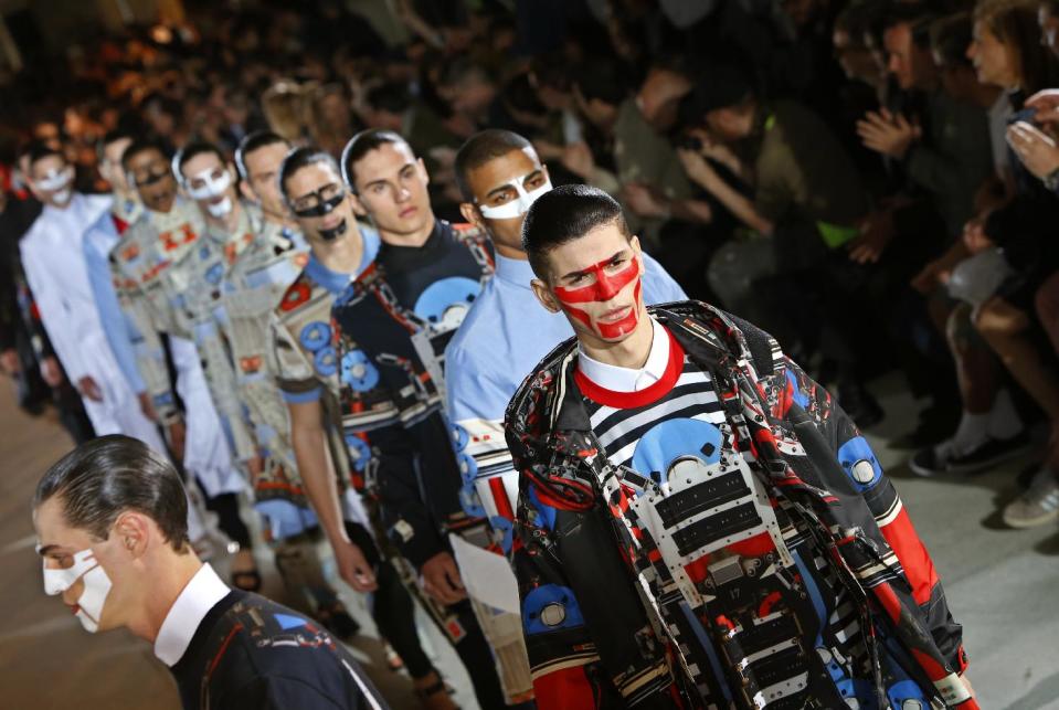 Model's present creations as part of the Givenchy men's fashion Spring-Summer 2014 collection, presented Friday, June 28, 2013 in Paris. (AP Photo/Francois Mori)