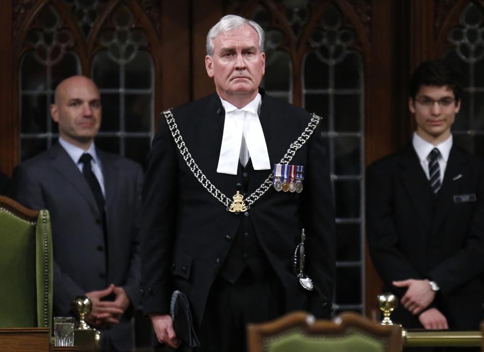 Canada's Sergeant-at-Arms Kevin Vickers is applauded in the House of Commons in Ottawa, in this file photo taken October 23, 2014. Vickers, who was credited for killing the shooter on Parliament Hill in October, will be named Canada's next ambassador to Ireland later today. REUTERS/Chris Wattie/Files (CANADA - Tags: POLITICS CRIME LAW)