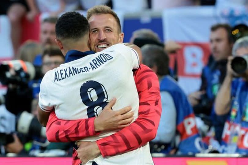 Trent Alexander-Arnold and Harry Kane embrace after beating Switzerland on penalties.