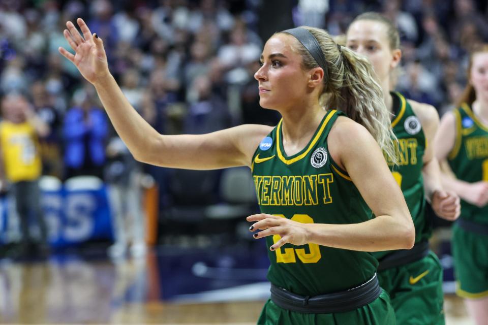 Emma Utterback waves to the crowd during an NCAA Tournament game between Vermont and Connecticut at Gampel Pavilion on Saturday, March 18, 2023.