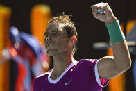 Rafael Nadal of Spain celebrates after defeating Yannick Hanfmann of Germany in their second round match at the Australian Open tennis championships in Melbourne, Australia, Wednesday, Jan. 19, 2022. (AP Photo/Andy Brownbill)