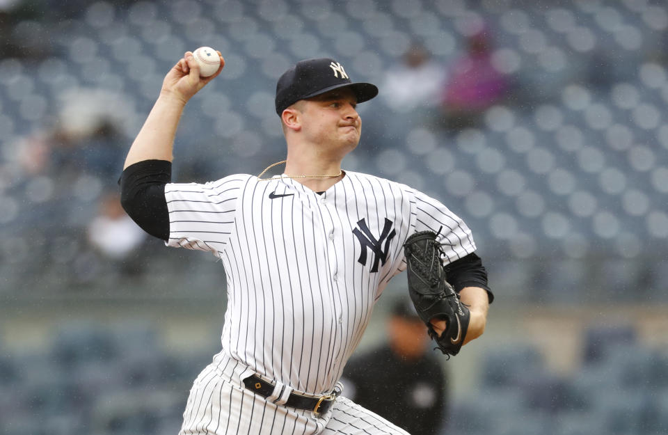 New York Yankees starting pitcher Clarke Schmidt (36) throws against the Arizona Diamondbacks during the first inning of a baseball game, Monday, Sept. 25, 2023, in New York. (AP Photo/Noah K. Murray)